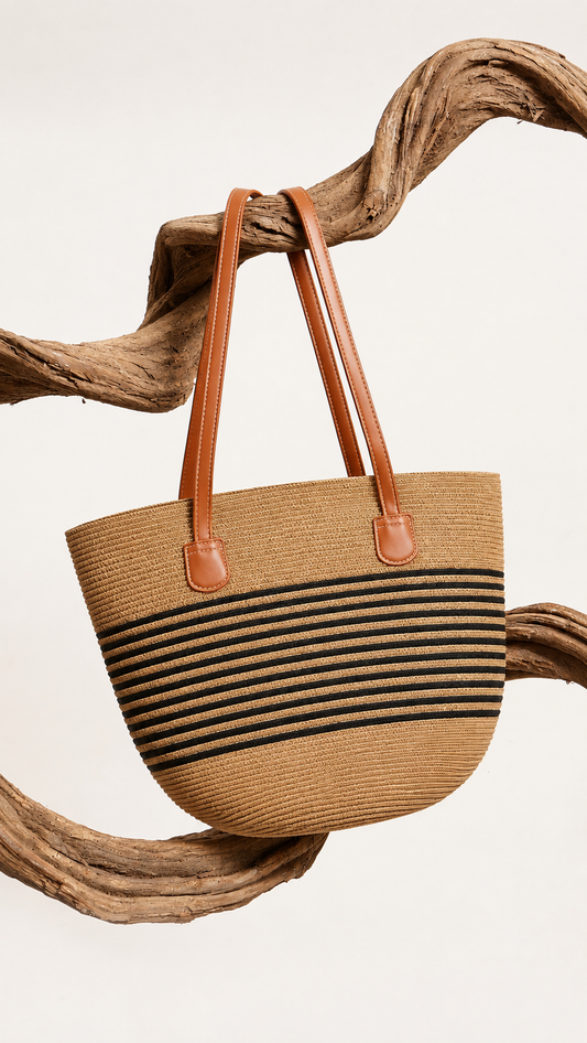 Straw Tote Bag hung on driftwood